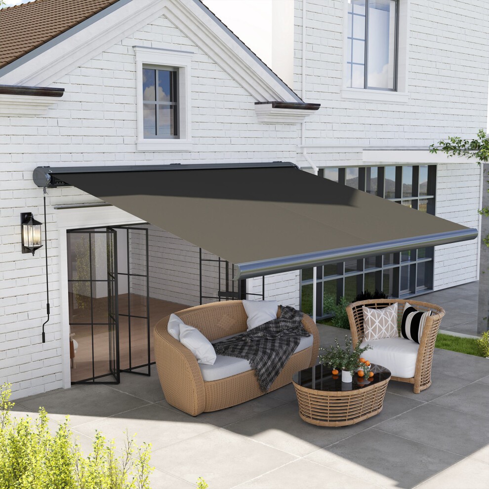 Outsunny 4x3m full cassette electric awning in dark grey with an aluminum frame, extending over a patio area with wicker furniture and a cozy blanket.