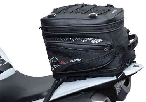 Black Oxford T40R Tailpack with a 40L capacity, featuring a durable material, mesh pockets, bungee cords on top, and a sleek design, mounted on a motorcycle seat.