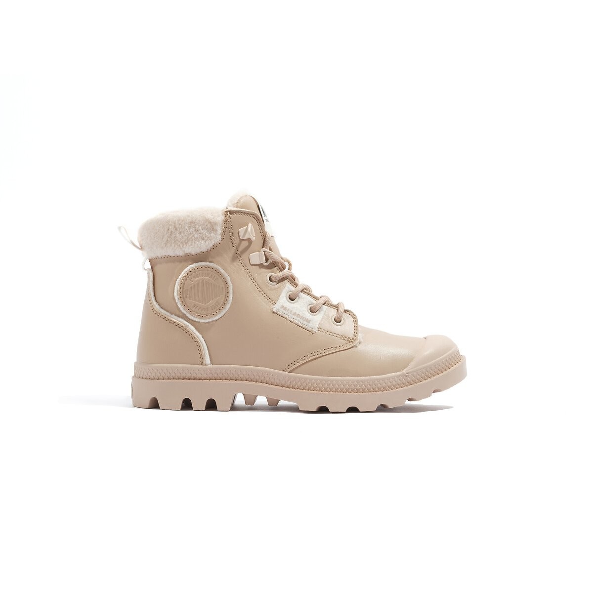 Cuban sand leather ankle boots with a faux fur collar, lace-up front, and rubber sole, featuring a round logo patch on the side.