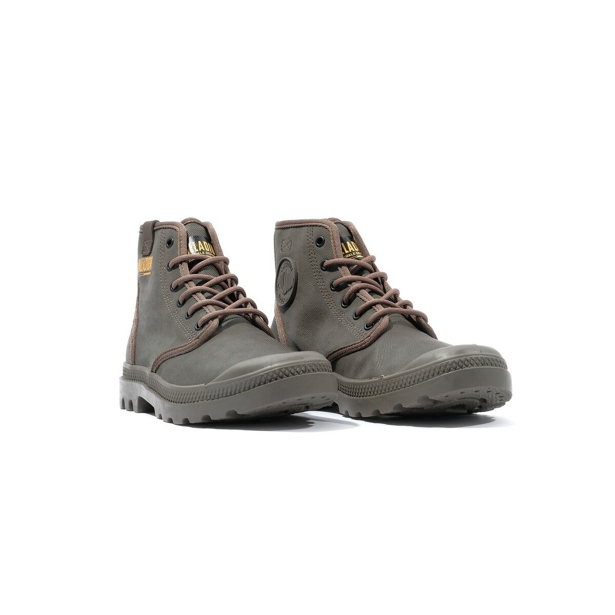 Brown coated leather ankle boots with round toe, rubber sole, and contrasting laces, featuring a logo patch on the side and a sturdy, rugged design.