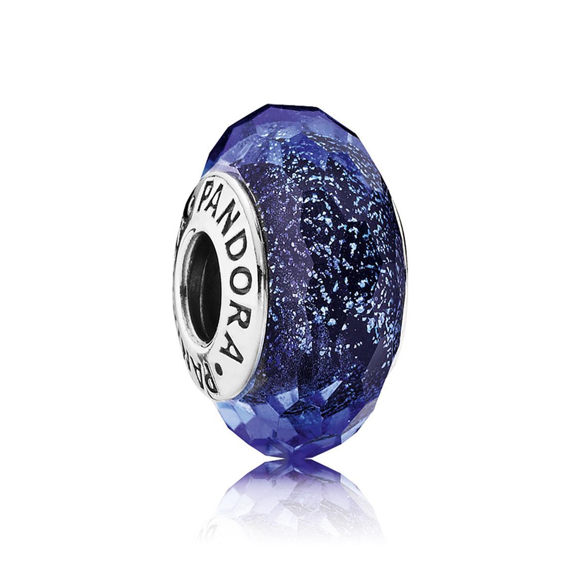 Blue faceted Murano glass charm featuring a shimmering design, encased in silver with the engraved "Pandora" logo on one side.