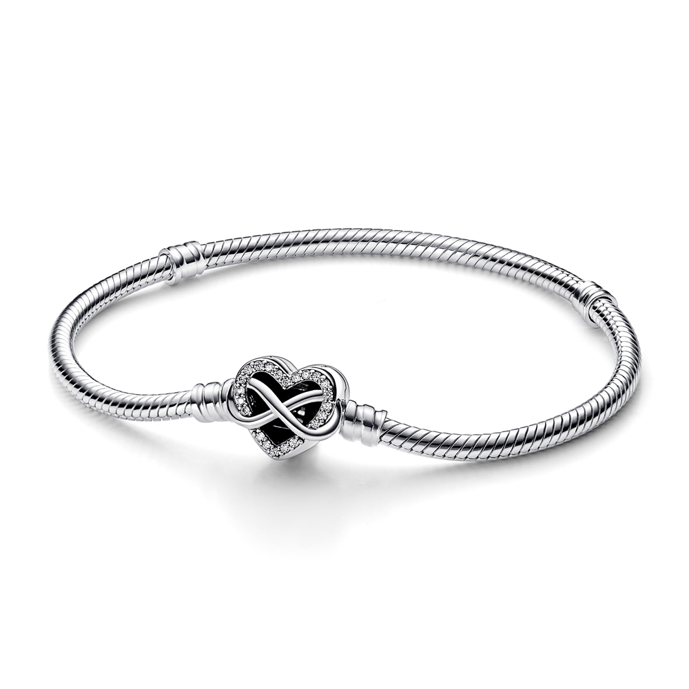 Sterling silver snake chain bracelet featuring a sparkling infinity heart clasp adorned with cubic zirconia, measuring 19 cm in length.