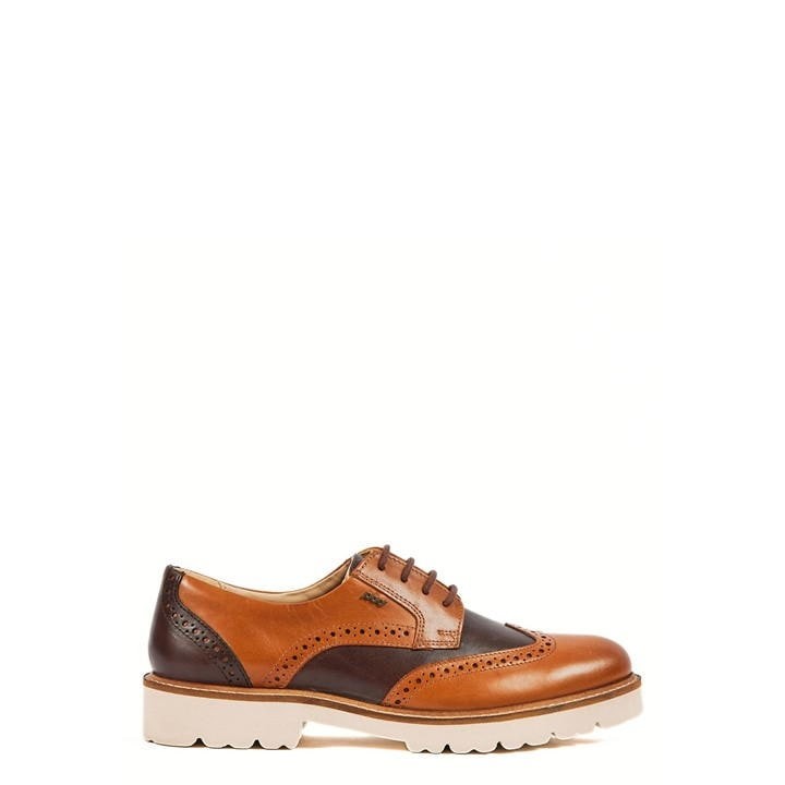 Brown leather brogues featuring a classic wingtip design, contrasting dark brown accents, and a chunky white sole for added comfort and style.
