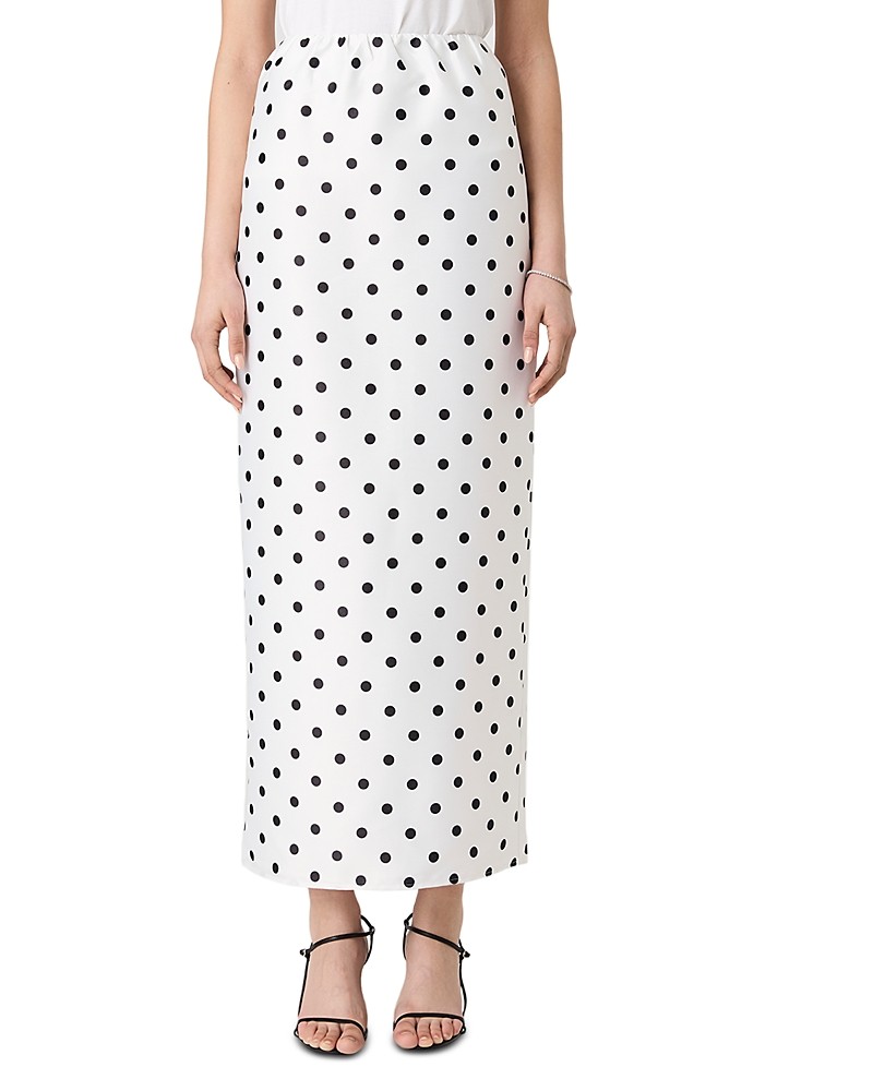White maxi skirt featuring a playful black polka dot pattern, designed by French Connection, with an elastic waistband and a flowy silhouette.