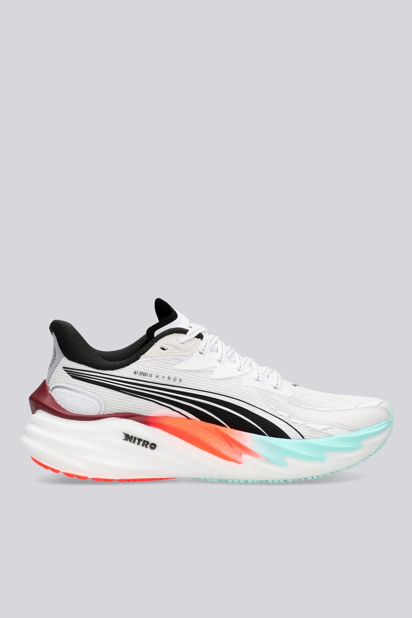 Puma Velocity Nitro 4 Hyrox women's sneakers in size 41, featuring a white mesh upper, black accents, and a colorful sole with red, turquoise, and orange details.