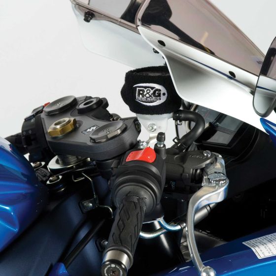 Black R&G Racing Clutch/Brake Reservoir Protector (Booty) fitted on a motorcycle, featuring a soft fabric material and a snug fit around the reservoir, with a blue bike body visible in the background.