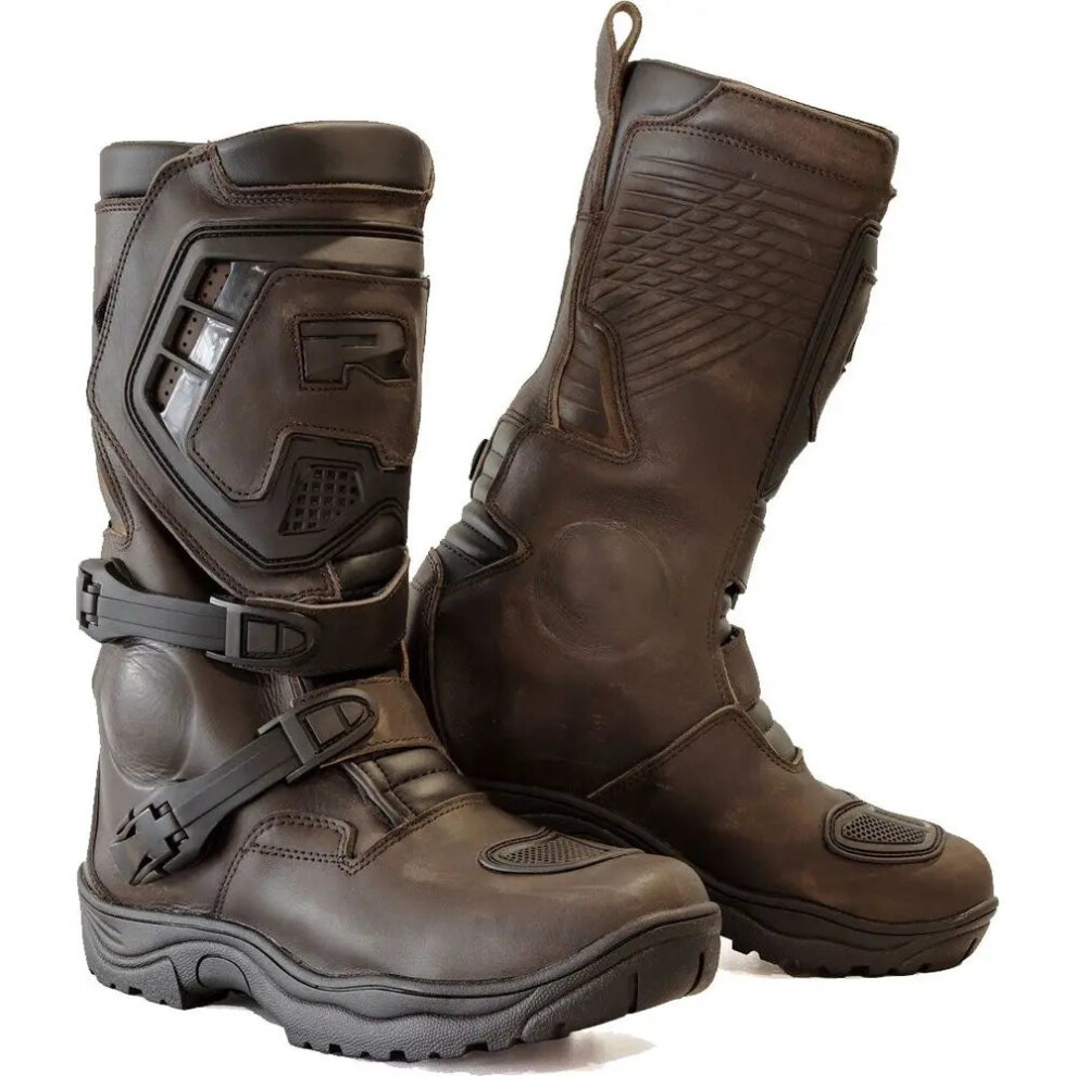Brown leather motorcycle boots with a sturdy design, featuring adjustable straps, reinforced panels, and textured surfaces for enhanced grip and protection.