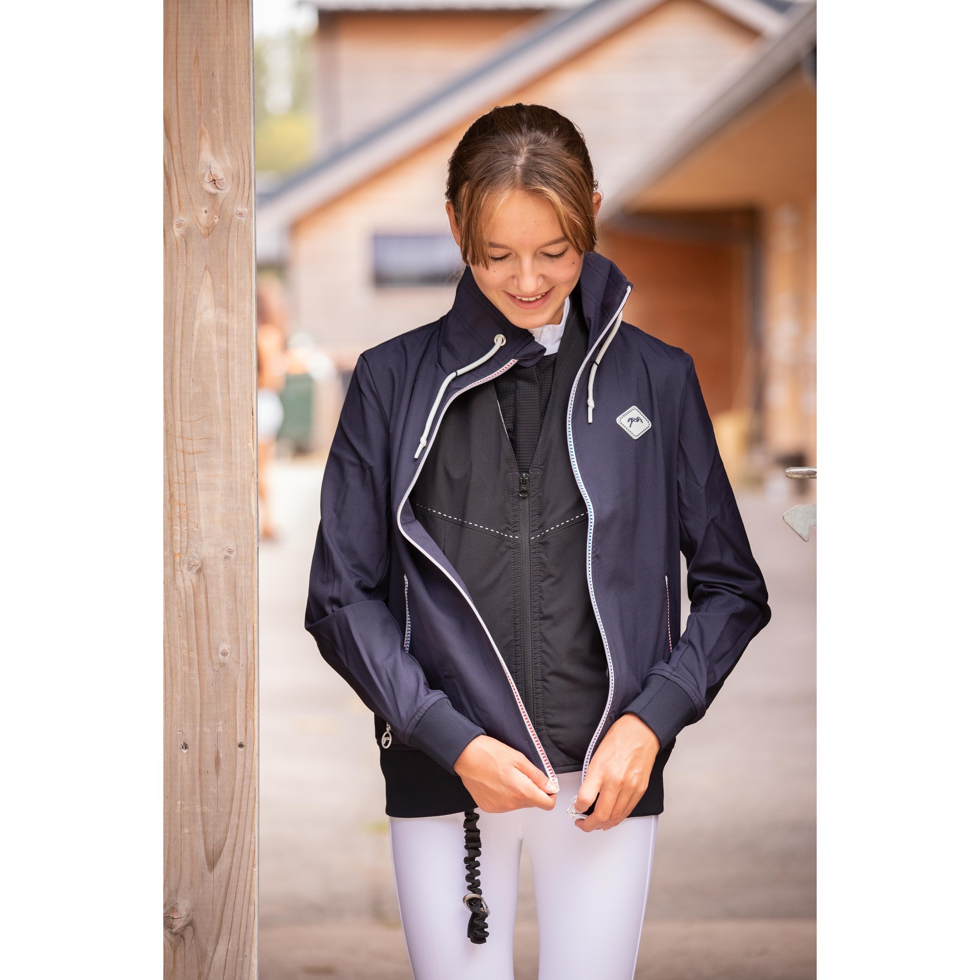 Women's Pénélope Airjacket in navy, featuring a sleek design, zippered front, high collar, and lightweight material, perfect for riding and outdoor activities.