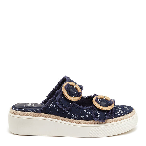 Navy casual sandal featuring a frayed fabric upper, two large decorative buckles, and a thick white platform sole with a woven jute accent.