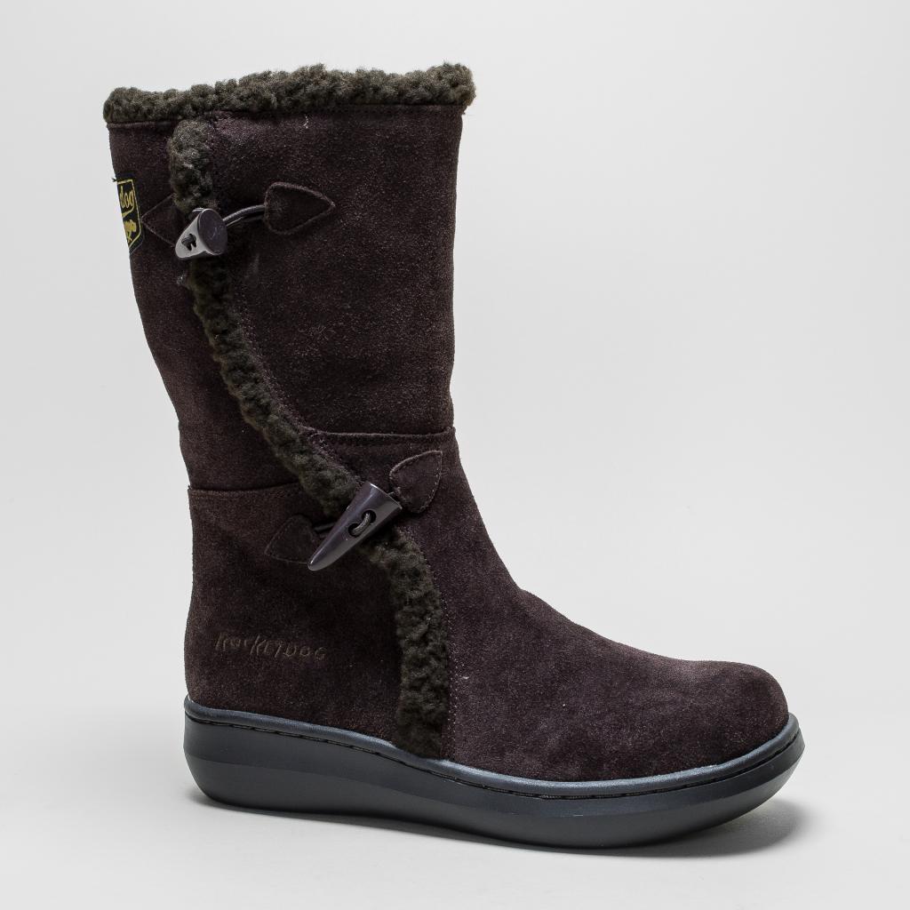 Brown mid-calf winter boot with a soft suede exterior, faux fur lining, and decorative buckles on the side, featuring a cushioned sole for comfort and warmth.