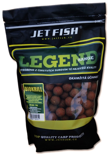 Black packaging featuring bold white and yellow text, labeled "Jus De Pomme" by Ridgeway Textiles, with a clear window showing round, reddish-brown fishing bait balls inside.