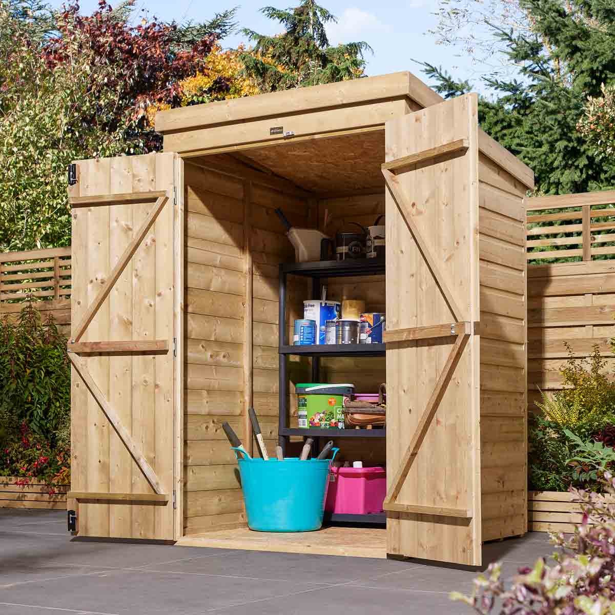 Brown wooden shiplap pent shed with double doors, featuring a slanted roof and interior shelving holding various tools and storage containers in a garden setting.