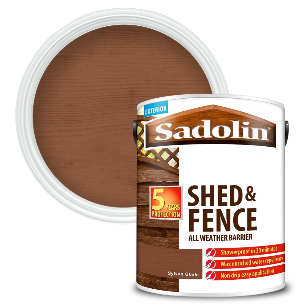 Brown paint canister labeled "Sadolin Shed & Fence Protector" with a 5-year protection mark, featuring a wax-enriched formula for easy application and water resistance.