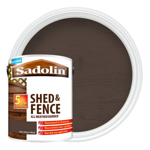 Sadolin Shed & Fence Protector in Woodland Walk color, a 5L metal can featuring a dark brown shade, labeled for all-weather protection with a wood grain design.