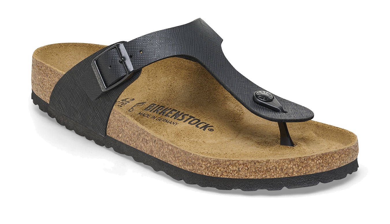 Black Birkenstock Gizeh sandals featuring a thong strap, adjustable buckle, and a cork footbed with a textured rubber sole.