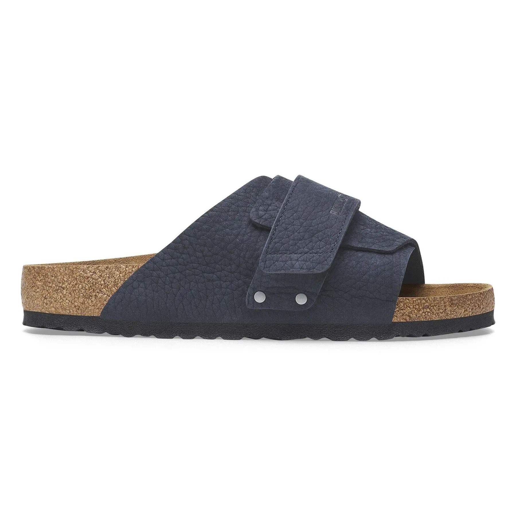 Navy nubuck leather sandals featuring a wide strap with a Velcro closure, a cork footbed, and a textured rubber sole for comfort and support.