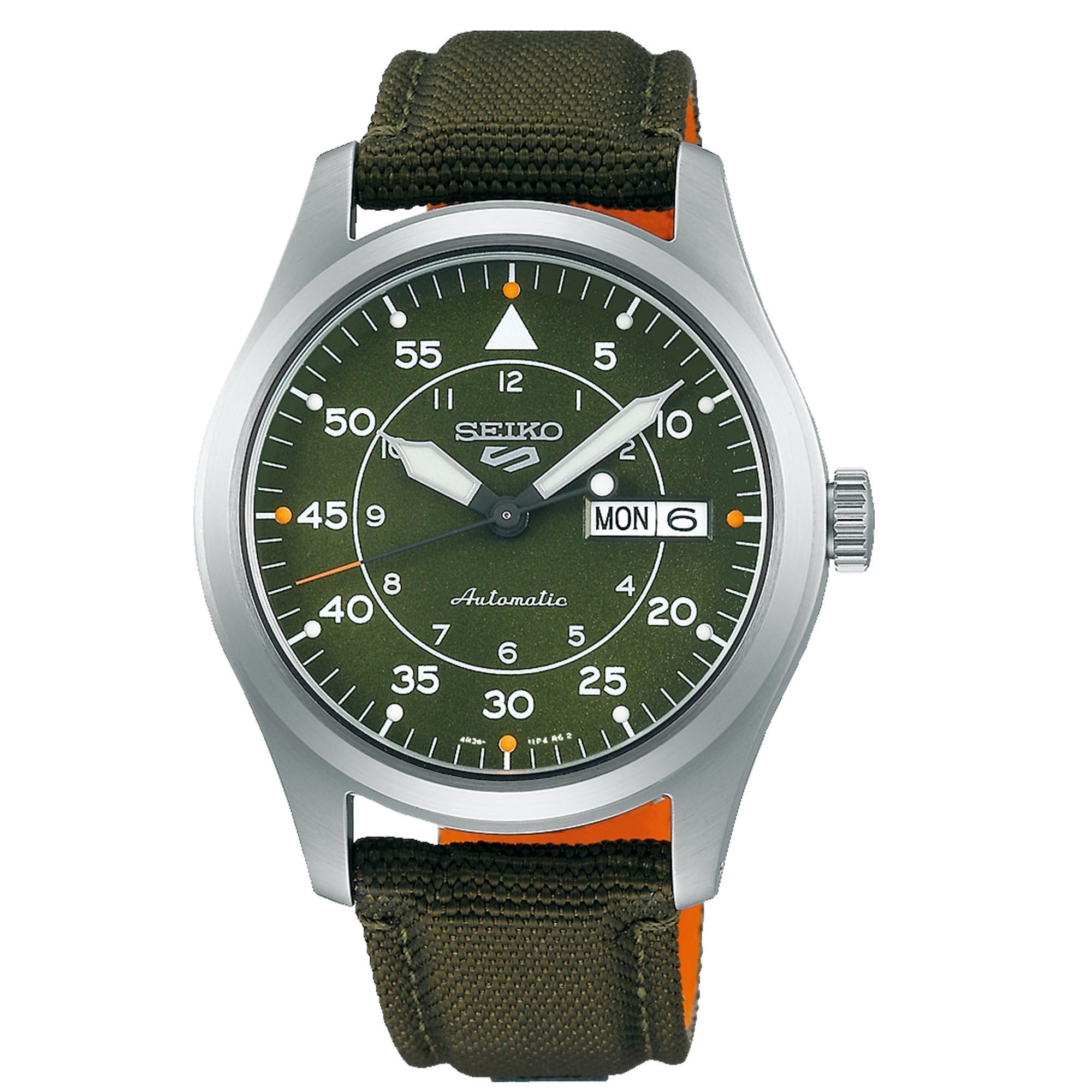 Seiko 5 SRPH29K features a green dial with white hour markers, a day-date display, and a stainless steel case, complemented by an olive green fabric strap with orange accents.