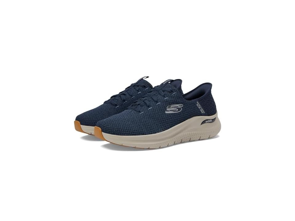 Navy synthetic men's shoes by Skechers feature a slip-in design, textured upper, and a cushioned sole with a light tan outsole for comfort and support.