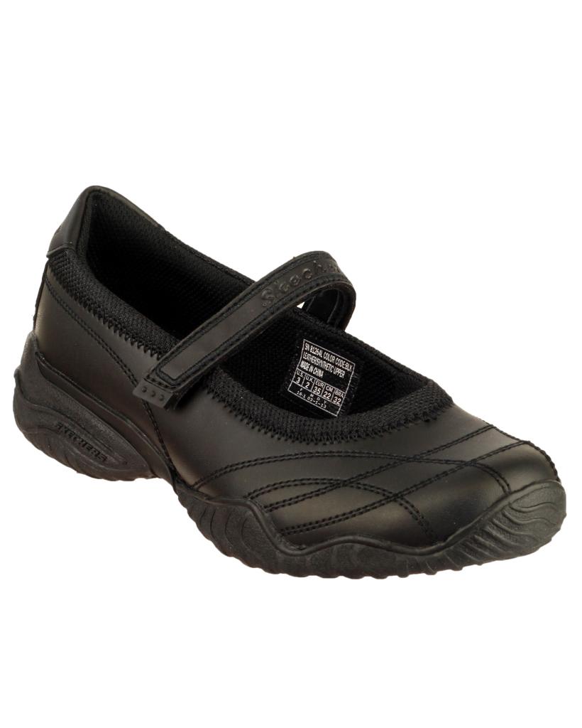 Black leather junior shoes by Skechers featuring a Mary Jane style with a Velcro strap, cushioned insole, and textured rubber sole for grip.