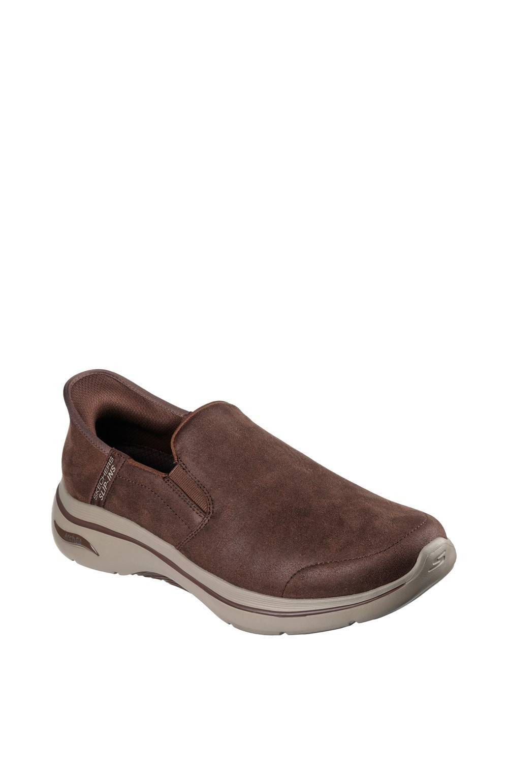 Brown slip-on trainers made of soft suede with a cushioned sole, featuring a sleek design and elastic panels for easy wear, in size 6 by Skechers.