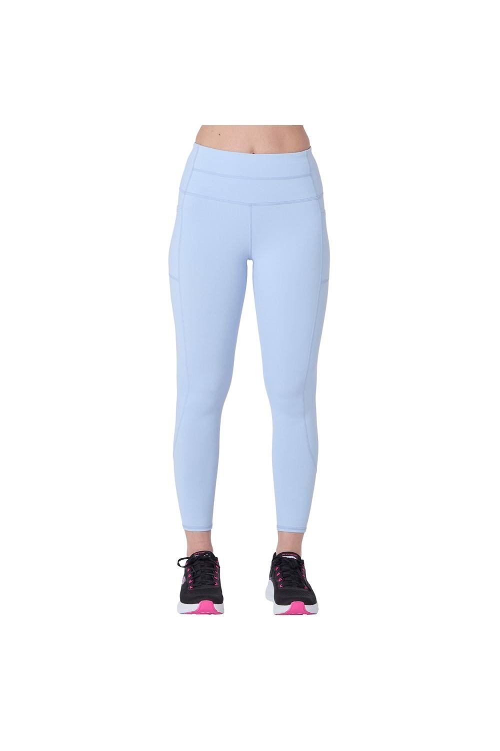Light blue high-waisted 7/8 leggings by Skechers, featuring a sleek design and stretchy material, paired with black and pink athletic shoes.