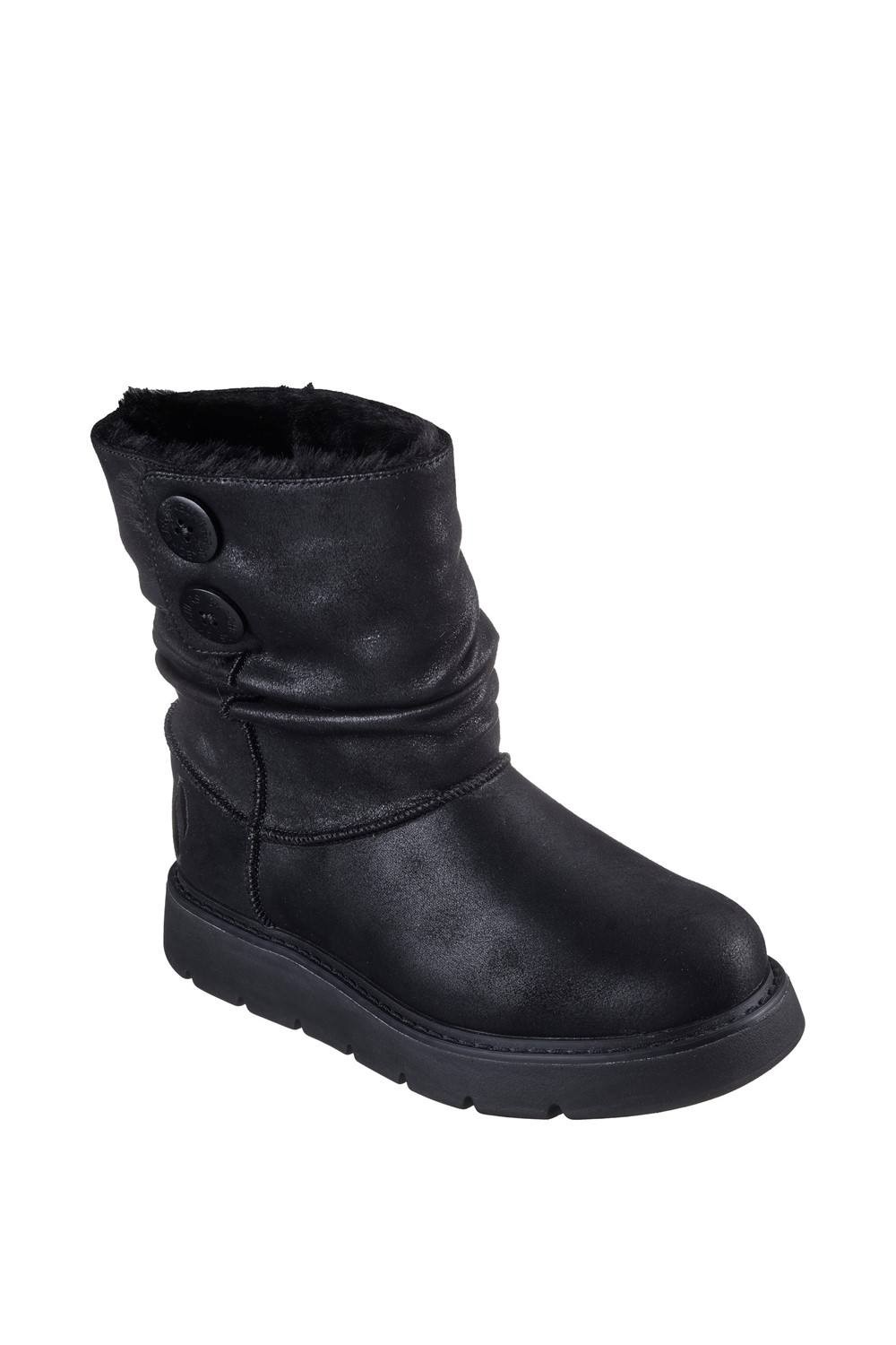 Black winter ankle boots with a soft textile upper, featuring a slouchy design, two decorative buttons on the side, and a thick rubber sole for comfort and warmth.