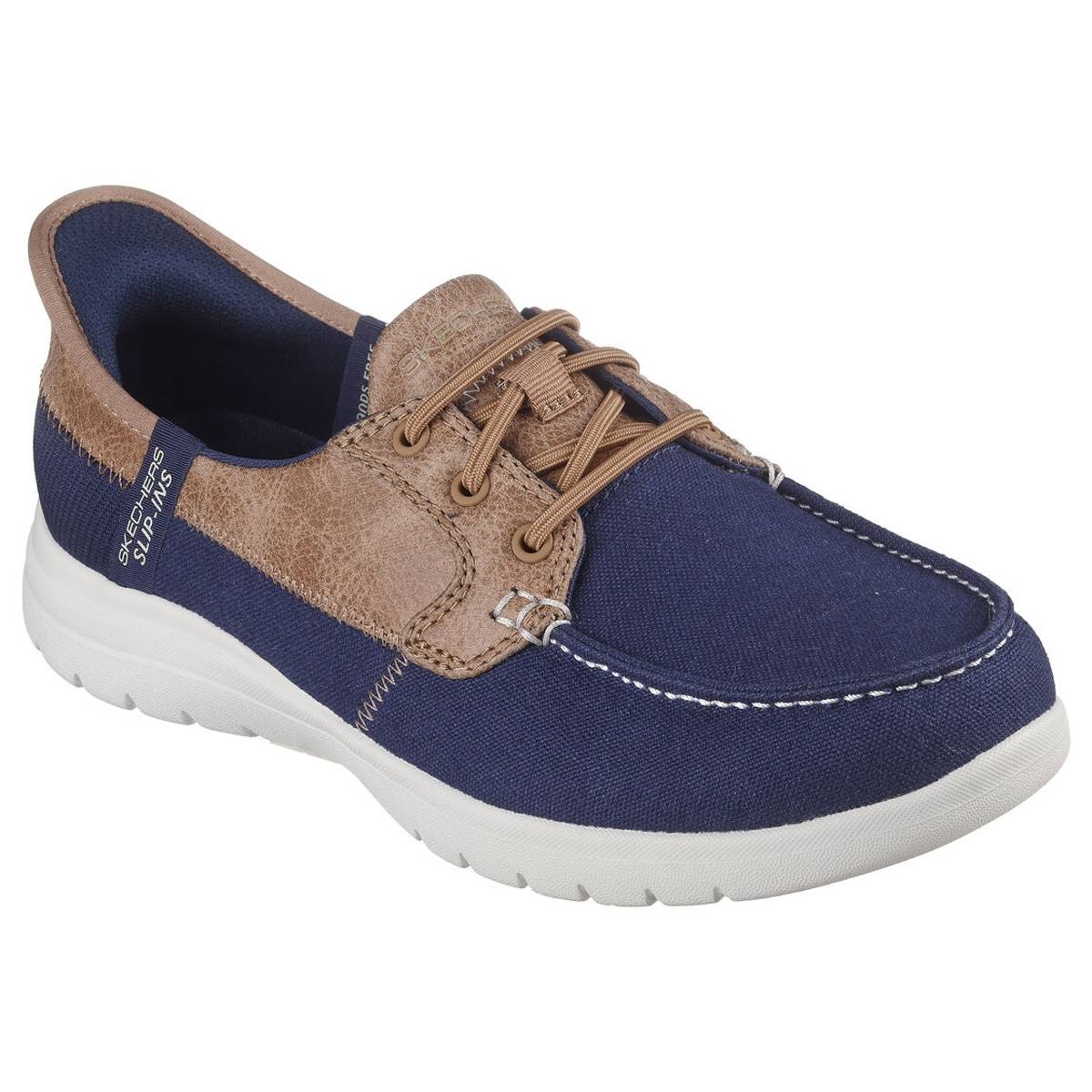Navy textile boat shoe with brown leather accents, featuring lace-up design, cushioned sole, and white stitching details for a casual, stylish look.