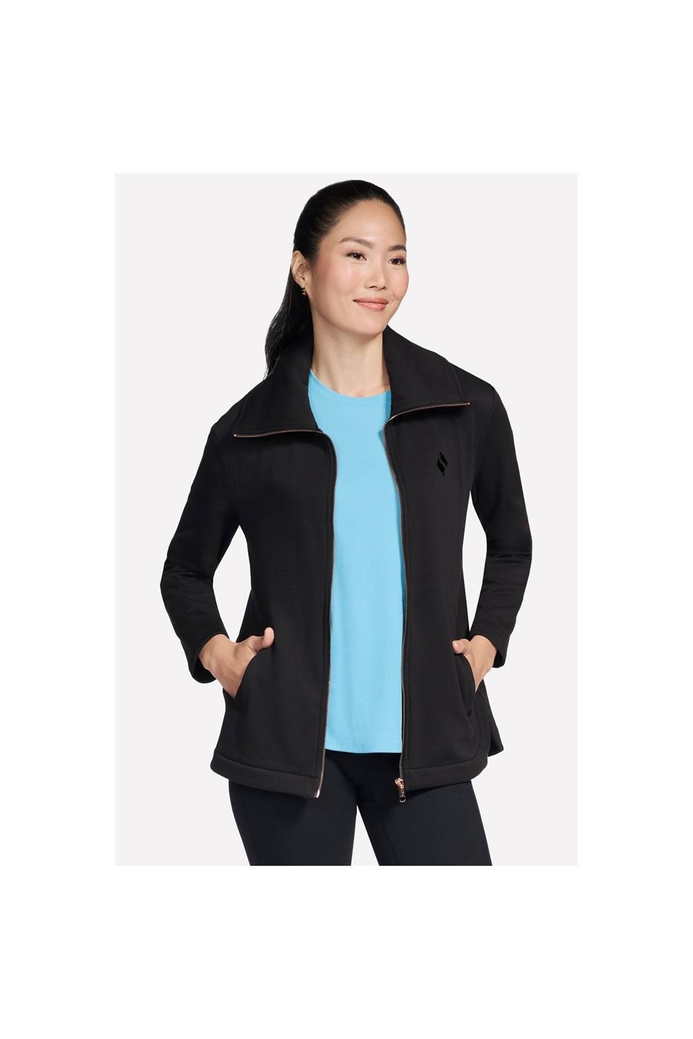 Black full-zip jacket with a soft material, featuring a high collar, side pockets, and a sleek design, worn over a light blue top.