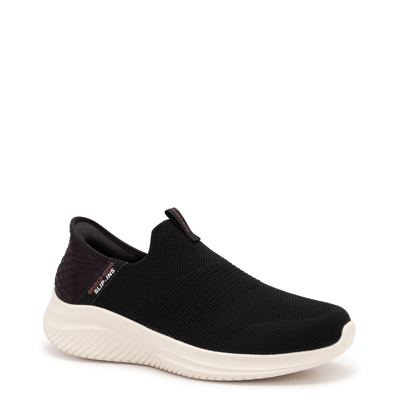 Black polyester slip-on trainers with a textured upper, featuring a cushioned white sole and elastic bands for a secure fit, designed for comfort and flexibility.