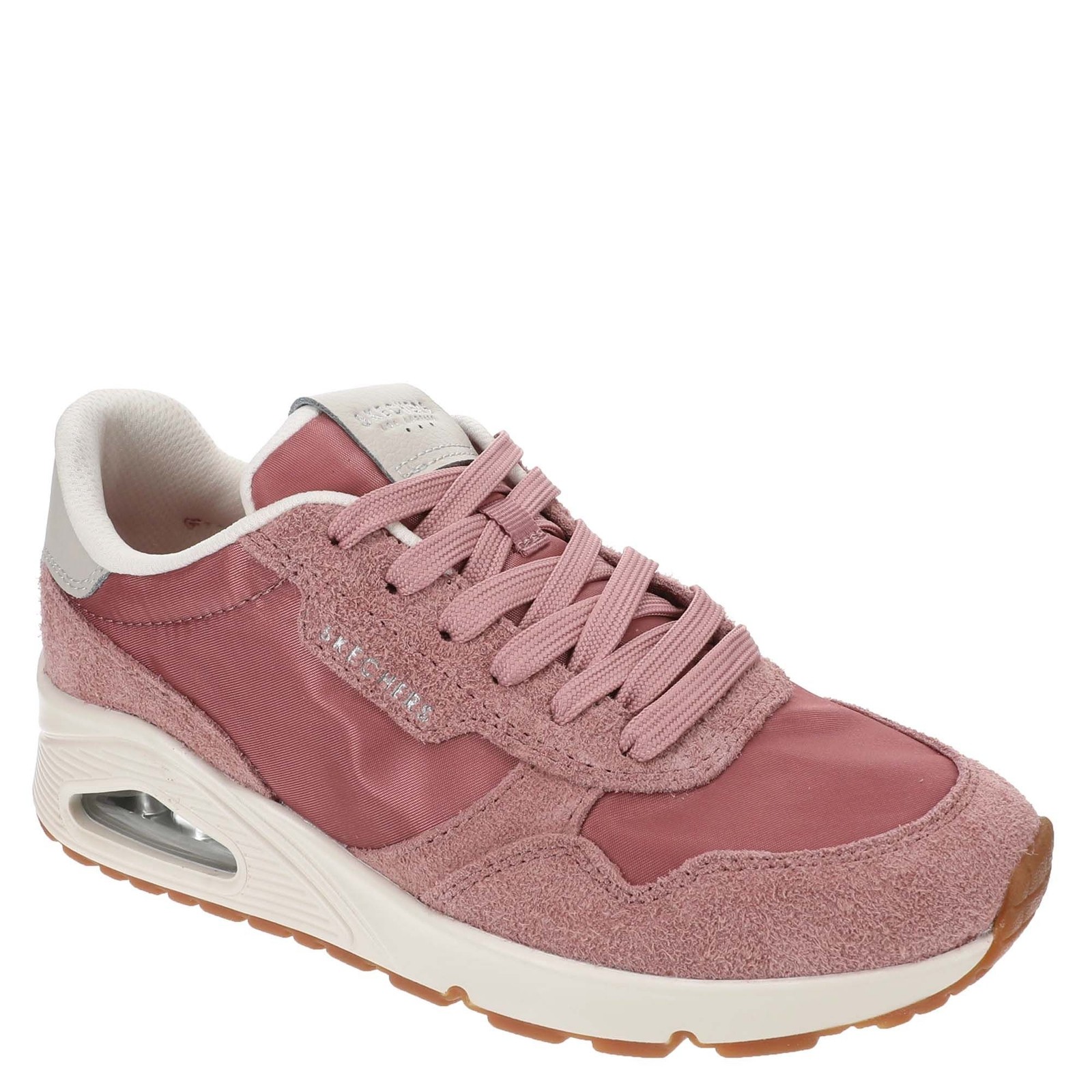 Rose-colored Skechers Uno Vintage Dayz trainers featuring a mix of smooth and textured materials, with a cushioned sole and air unit, complemented by a light grey heel and laces.