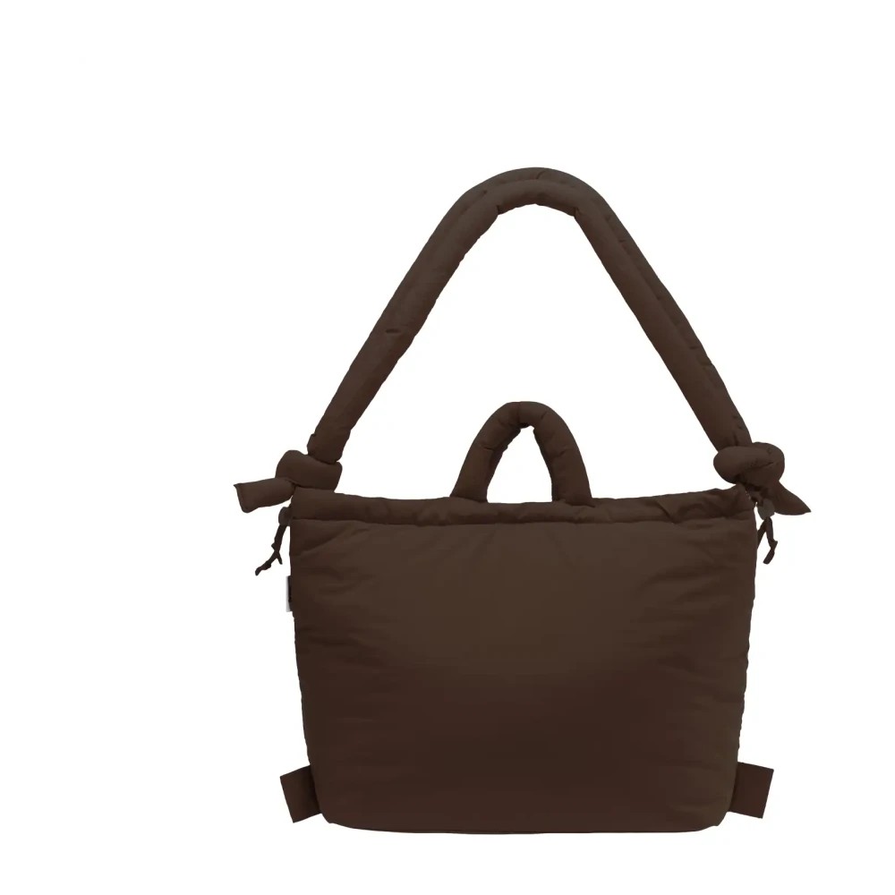 Chocolate brown soft nylon multiwear crossbody bag featuring a padded handle, knotted detailing, and a spacious design for versatile use.