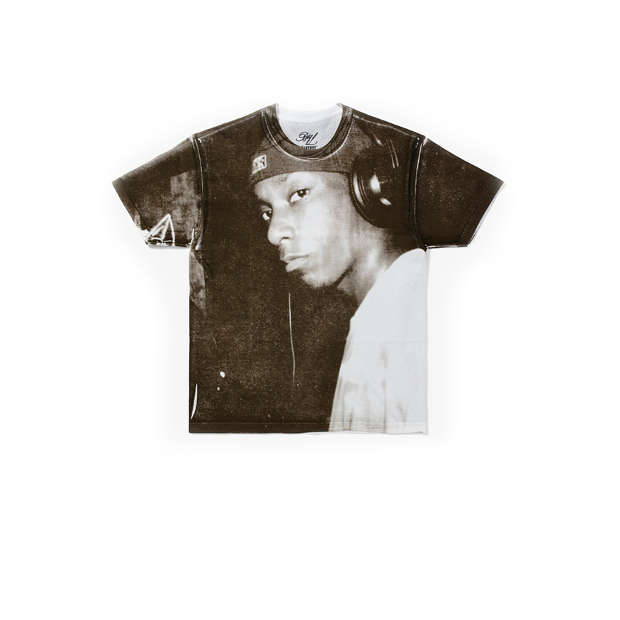 Multicolored short-sleeve T-shirt featuring a large graphic print of a person's face, with a black and white design and contrasting colors, made from soft fabric, size 2XL.