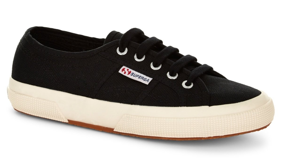 Black canvas sneaker with white rubber sole, featuring a lace-up front and Superga logo on the side, designed for a classic casual look.