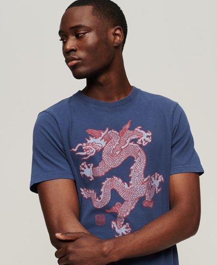 Navy blue T-shirt featuring a bold red dragon graphic on the front, made from soft cotton material with a classic crew neck and short sleeves.