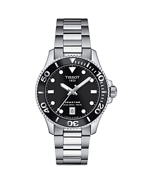TISSOT Seastar 1000 watch featuring a black dial, stainless steel case and bracelet, 36mm size, luminous hands, and a date display at 6 o'clock.