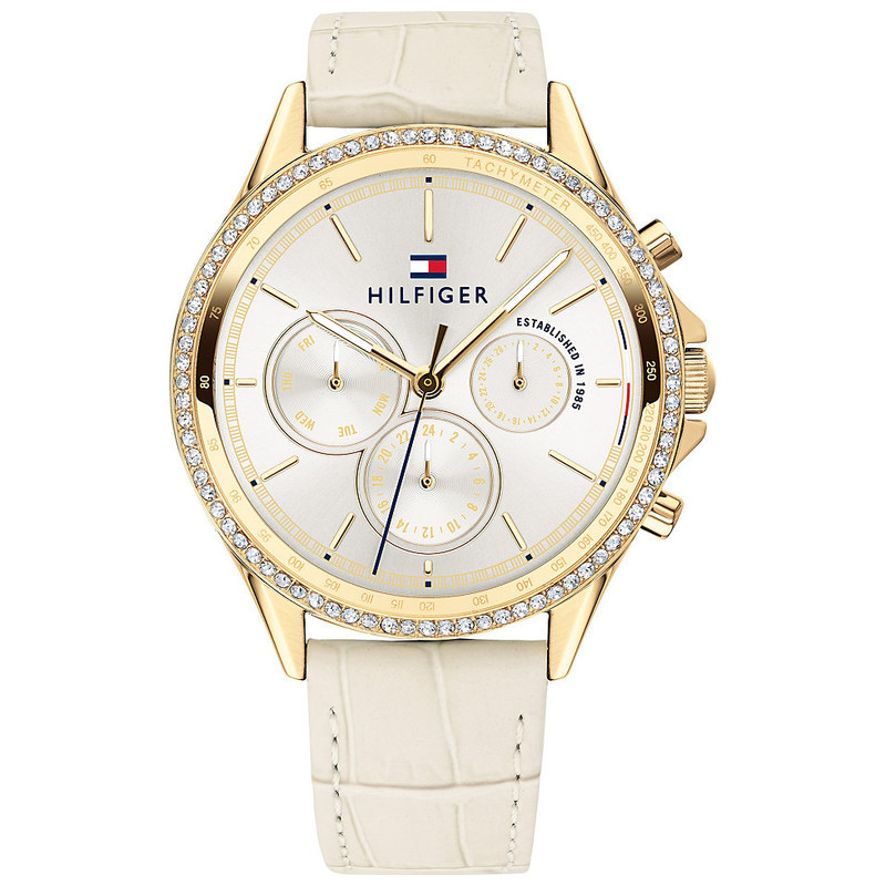 Women's Tommy Hilfiger Ari watch features a 39mm white dial, gold-tone accents, three sub-dials, and a cream leather strap with a crocodile texture.