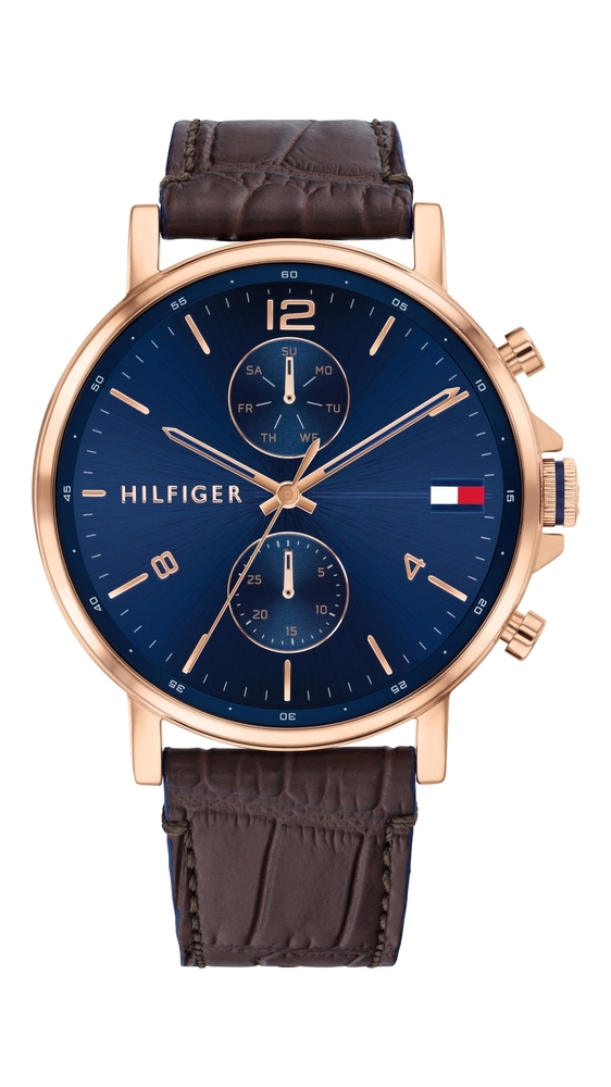 Men's Tommy Hilfiger multifunction watch featuring a 44mm blue dial, rose gold-tone case, brown leather strap, and chronograph subdials with date display.