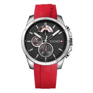Men's Tommy Hilfiger Decker chronograph watch featuring a 46mm black dial, silver-tone case, and a vibrant red silicone strap with textured detailing.