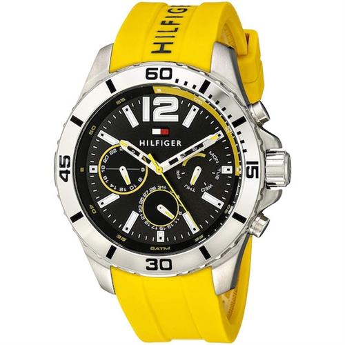 Men's Tommy Hilfiger Nolan watch featuring a 46mm dark grey dial, silver-tone case, and yellow silicone strap with chronograph functions and bold hour markers.