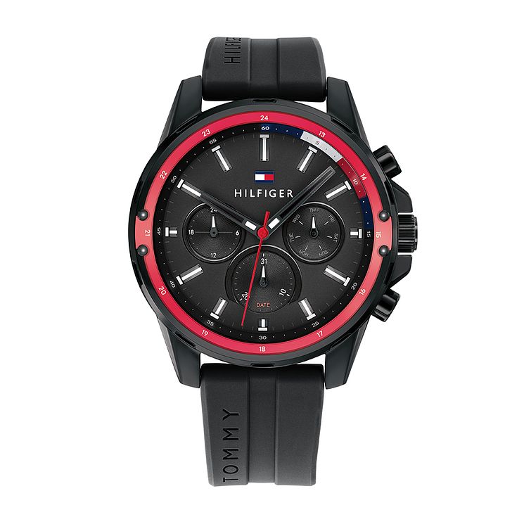 Men's Tommy Hilfiger Mason watch featuring a 45mm black dial, silicone strap, red accents, and multiple chronograph functions.