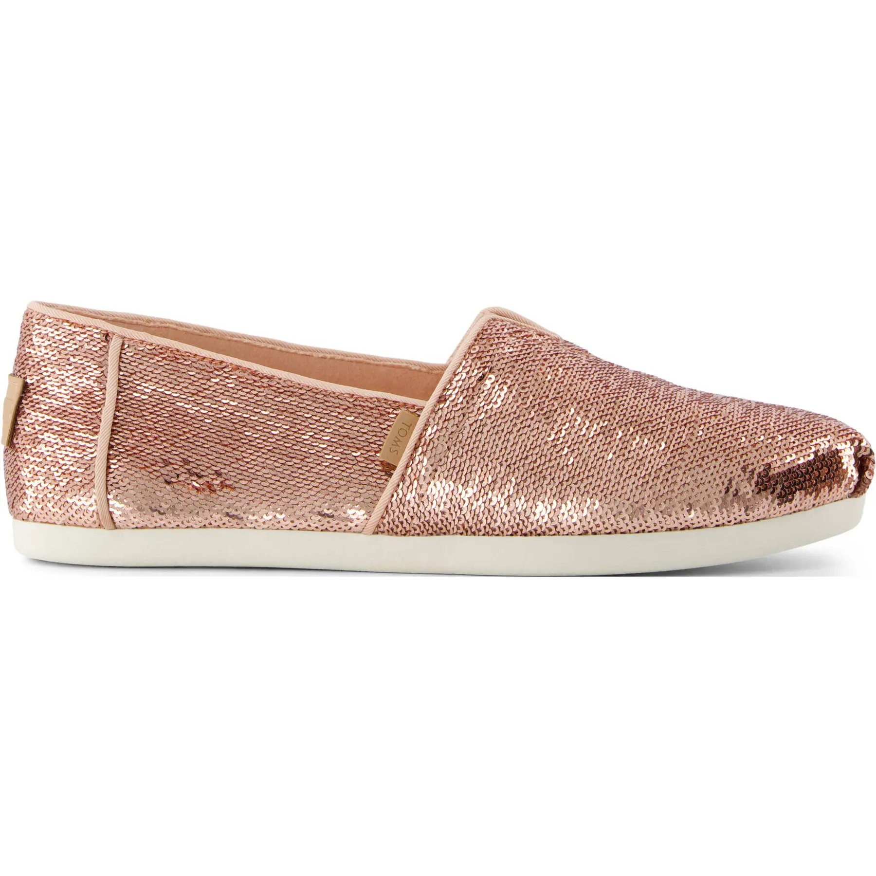 Rose gold sequined textile espadrilles with a slip-on design, featuring a soft interior lining and a white rubber sole, perfect for casual wear.