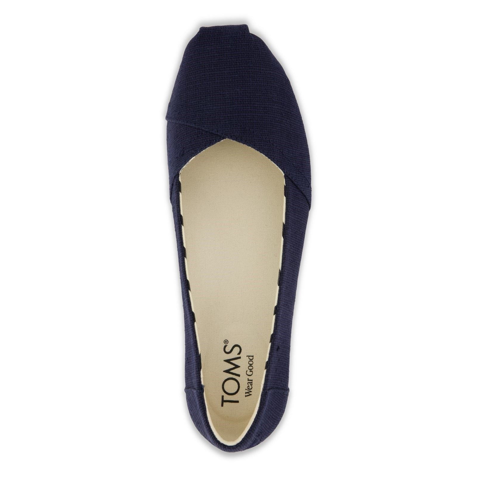 Navy heritage canvas ballet flat with a rounded toe and elasticized upper, featuring a soft insole and TOMS logo on the interior.