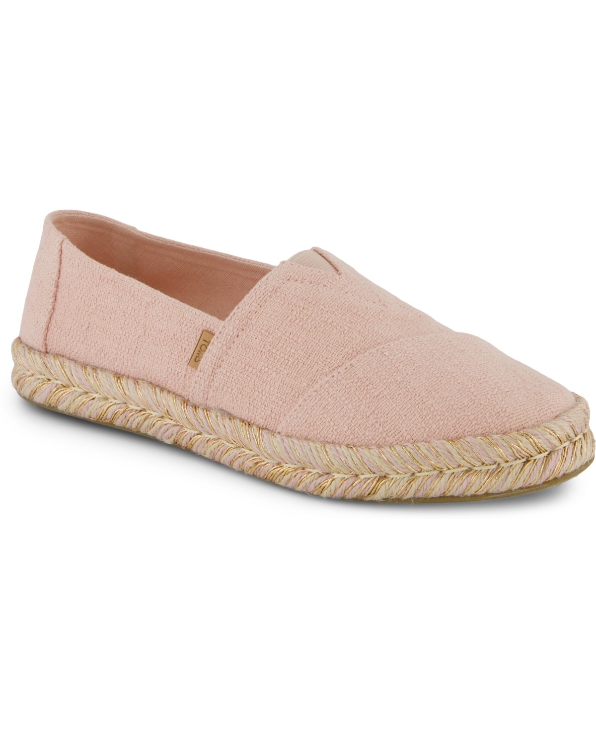 Pale rose canvas slip-on shoe with a textured finish, featuring a braided jute sole and a small TOMS logo on the side.