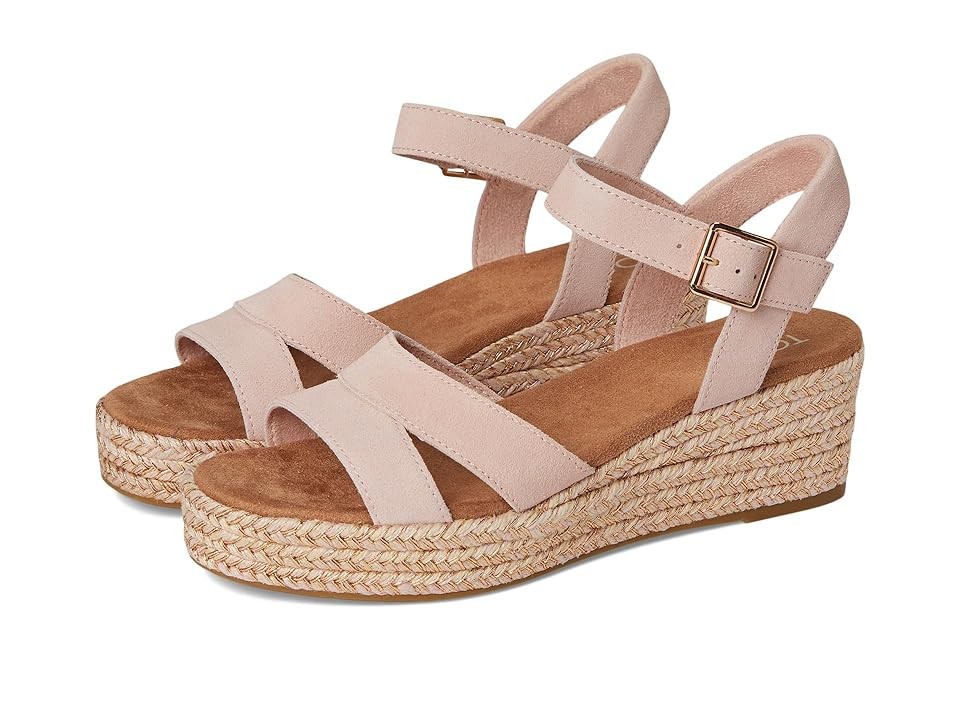 Pale rose pink TOMS women's Audrey sandals featuring a wedge design, soft suede straps, an adjustable ankle buckle, and a woven jute platform.