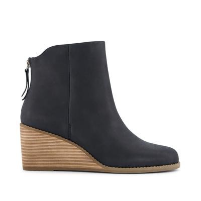 Black leather wedge boot with a sleek design, featuring a rounded toe, a side zipper, and a textured, stacked wedge heel.