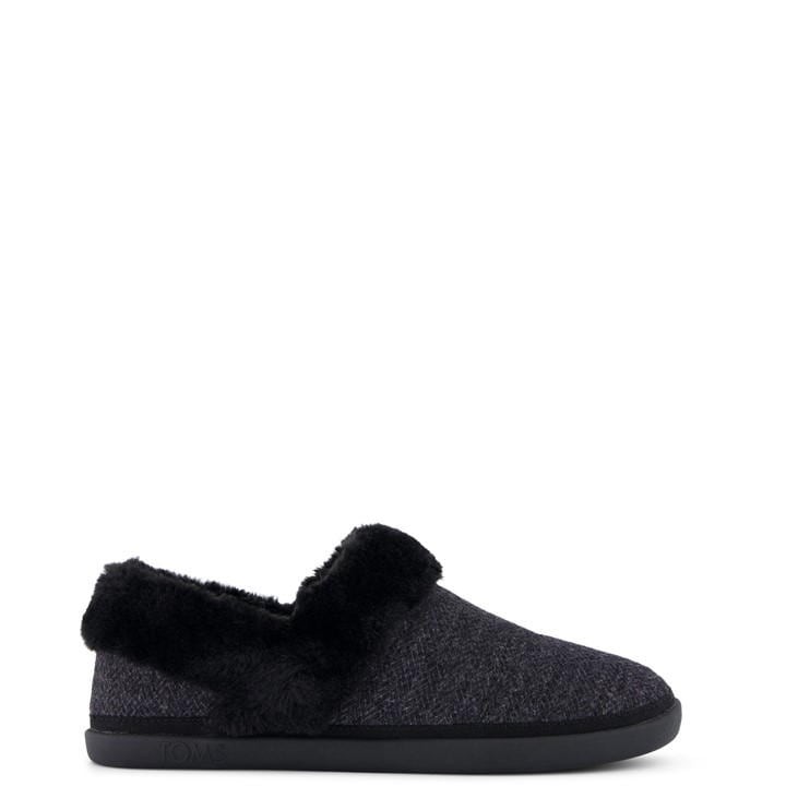 Black TOMS Women's Oslo Slipper featuring a soft, fuzzy collar and a cozy, textured upper with a durable black sole.