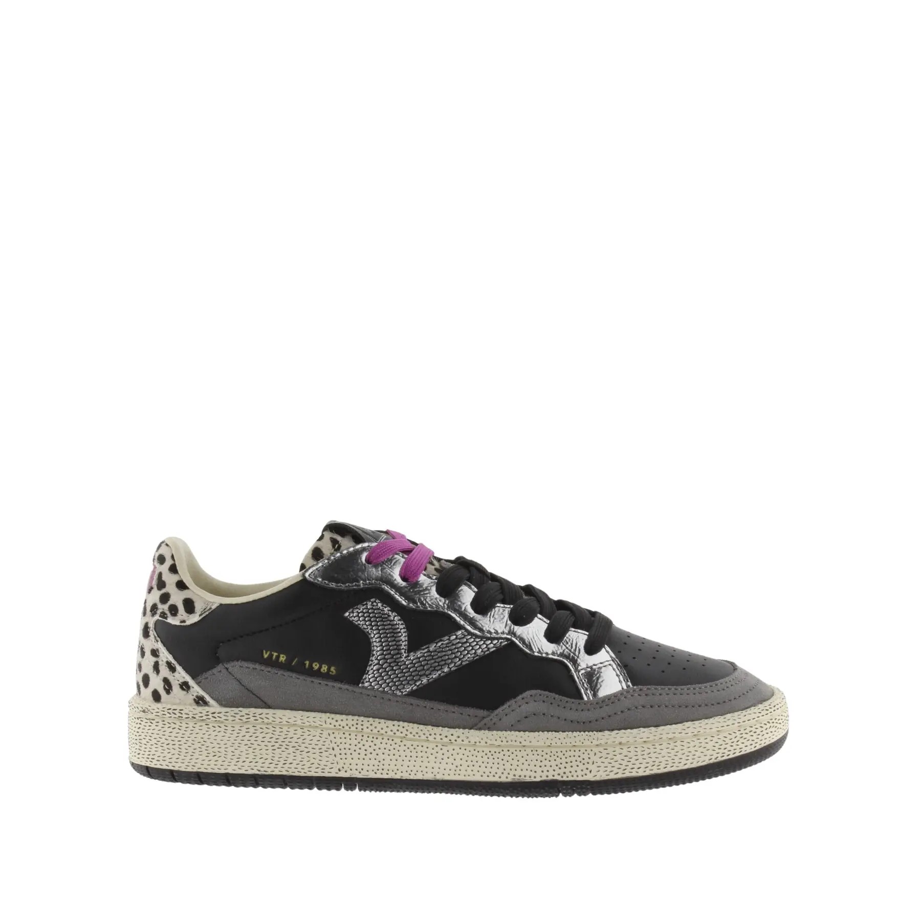 Black and grey trainers with a textured animal print heel, silver accents, purple laces, and a chunky sole, featuring the Victoria logo on the side.