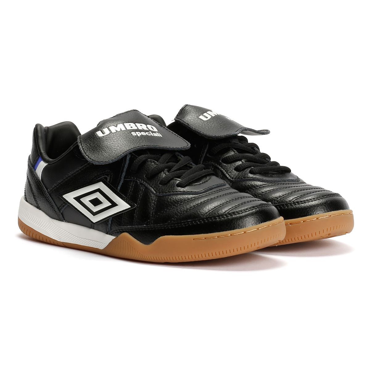 Black leather trainers with white and gum sole, featuring a prominent white Umbro logo and adjustable Velcro strap for secure fit.