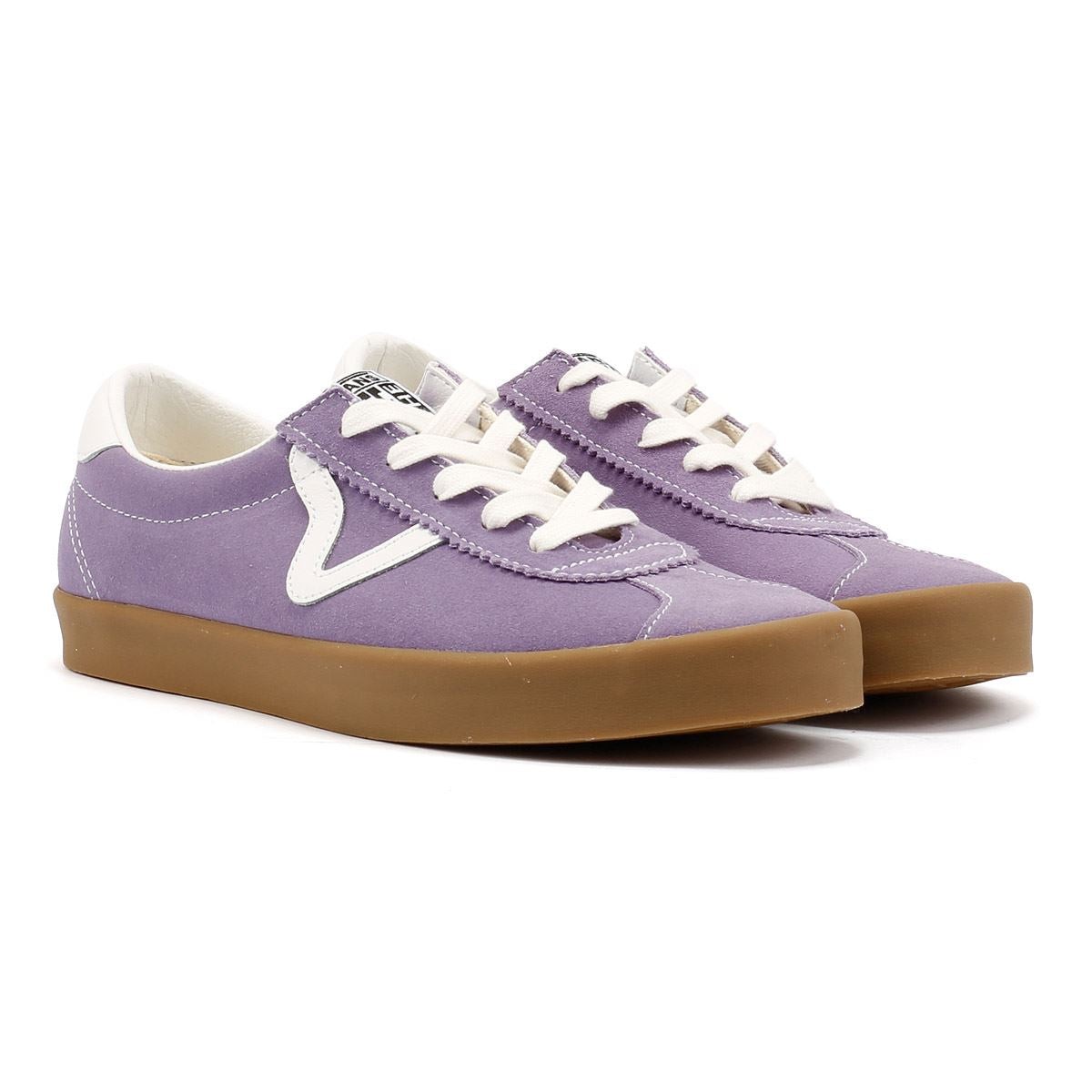 Purple suede low-top trainers with white laces and a contrasting white V logo, featuring a brown rubber sole for added grip.