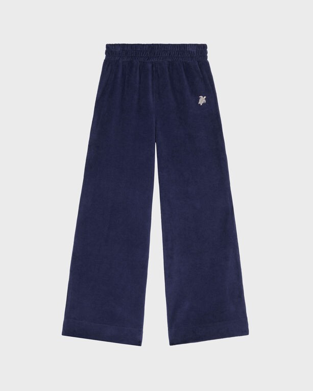 Blue velvet jogger pants for boys by Vilebrequin, featuring an embroidered turtle logo, with an elastic waistband and wide legs, available in size 8.